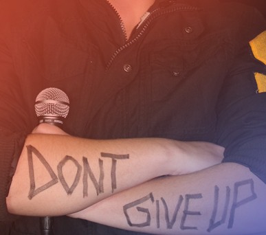 "Don't give up" written on arms